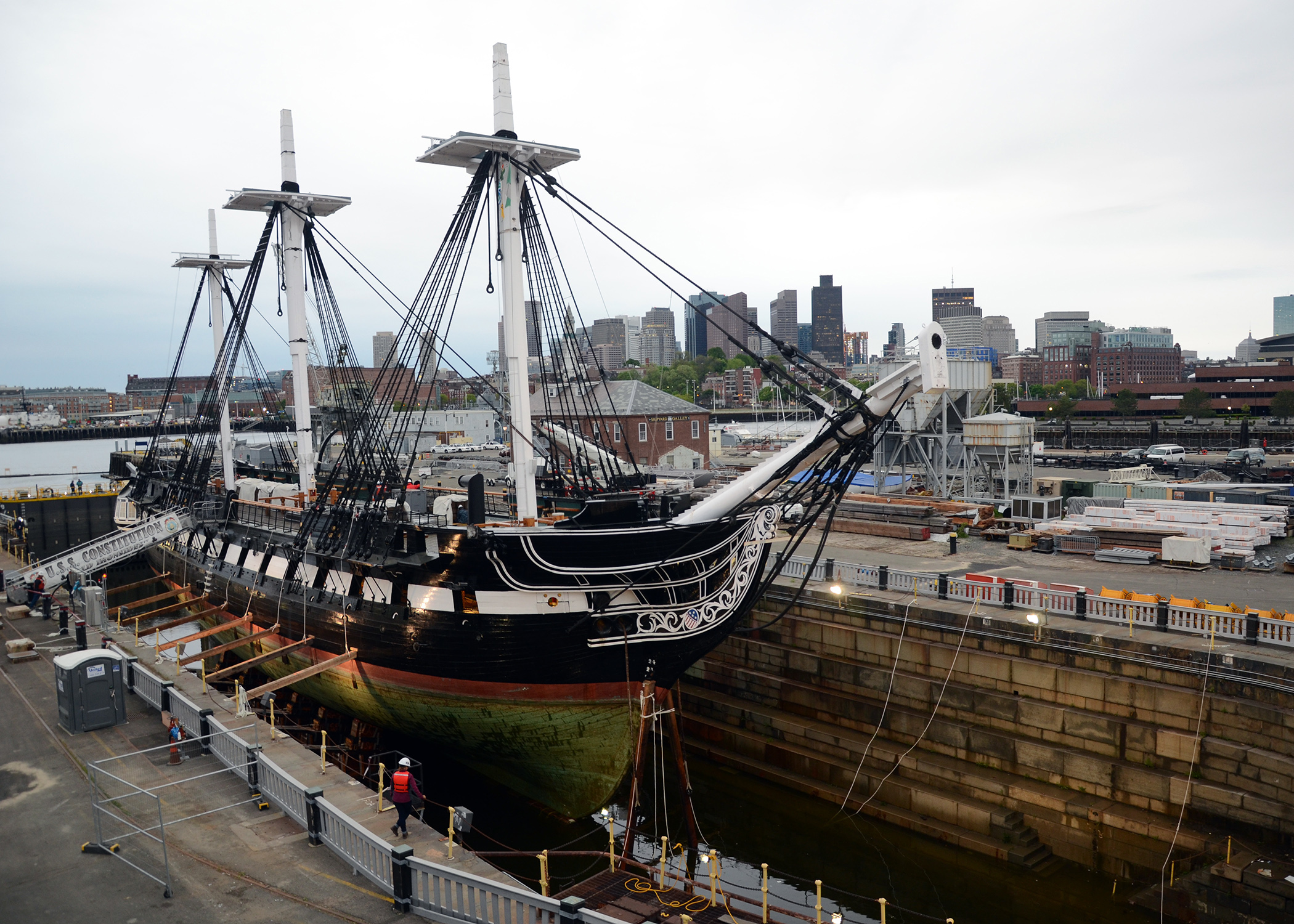 Constitution drydock for restoration with boston skyline in the background