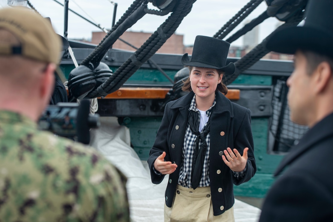 Photo captured Emma Hoernlein in her historic uniform, giving tour and explaining