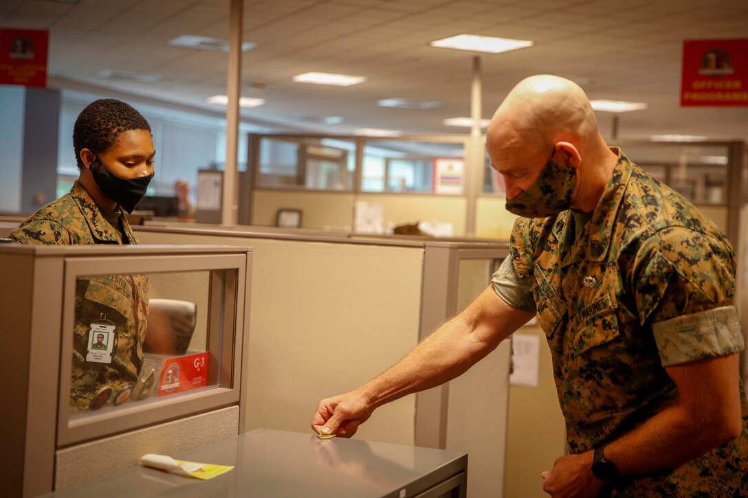 The 19th Sergeant Major of the Marine Corps, Troy E. Black, greets Lance Cpl. Alexus Lester during a visit to Marine Corps Recruiting Command (MCRC) at Marine Corps Base Quantico, Va, June 15, 2020. The Sergeant Major of the Marine Corps conducted the visit to receive updates on MCRC’s mission to find qualified men and women who will contribute to the future of the Corps and our country. (U.S. Marine Corps photo by Sgt. Victoria Ross)