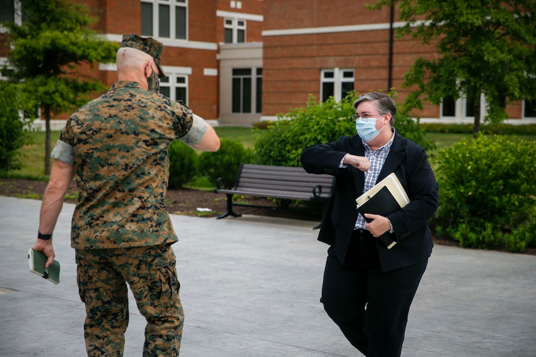 The 19th Sergeant Major of the Marine Corps, Troy E. Black, greets Marine Corps historian, Ms. Annette Amerman during a visit with the Marine Corps History Division (HD) at Marine Corps Base Quantico, Va, June 15, 2020. The Sergeant Major of the Marine Corps conducted the visit to discuss the importance of HD’s mission to research and write the Marine Corps’ official history. HD also provides reference and research assistance; preserves personal experiences and observations through oral history interviews; and deploys field historians to record history in the making. (U.S. Marine Corps photo by Sgt. Victoria Ross)