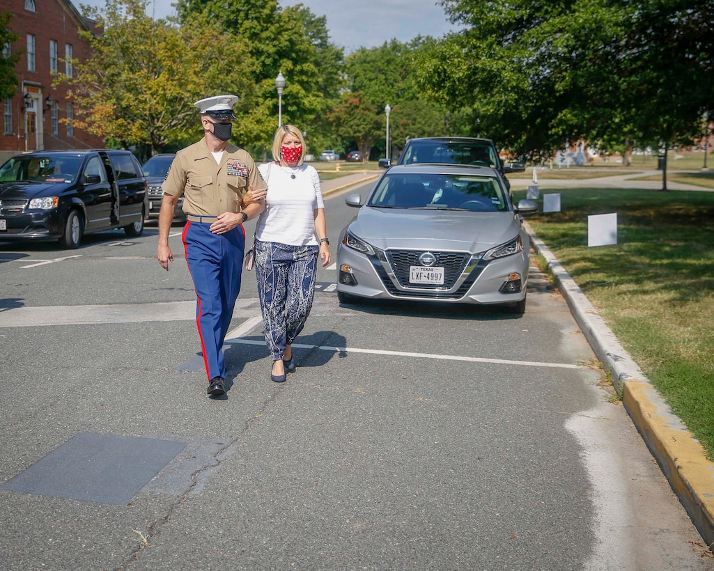 The 19th Sergeant Major of the Marine Corps, Sgt. Maj. Troy E. Black, accompanied by his wife, Mrs. Stacie Black arrive at the Marine Corps Recruiting Command (MCRC) change of command ceremony at Marine Corps Base Quantico, V.A., July 17, 2020. Major General James W. Bierman relinquished command to the new MCRC Commander, Brigadier General Jason Q. Bohm. The traditions exhibited in the ceremony represent the passing of authority from one commander to another. (U.S. Marine Corps photo by Sgt. Victoria Ross)