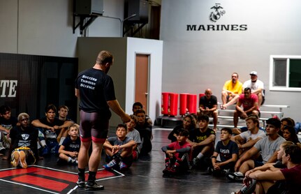 Kyle Snyder, 2016 Olympic gold medalist and 4x world wrestling champion, speaks to participants during a wrestling clinic at The Treigning Lab, in Orange County, Calif. on July 25, 2020. The Treigning Lab hosted a wrestling clinic led by the champion, to teach younger wrestlers new techniques. To safeguard the health of the clinician and registrants, a COVID-19 test was administered to attendees prior to entering the building.