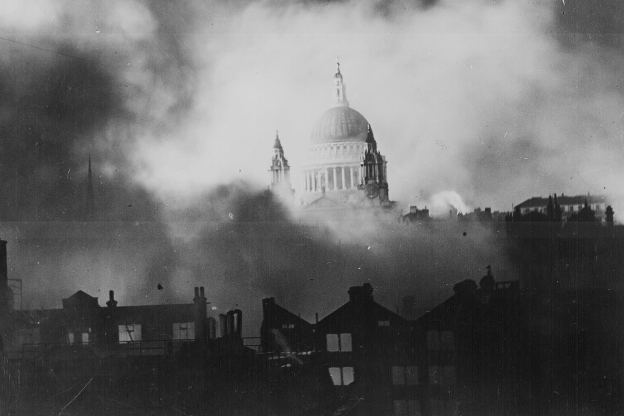 Saint Paul's Cathedral in London is seen as the city burns around it .