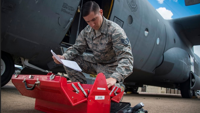 Staff Sgt. Wayne Russell takes inventory of a tool box