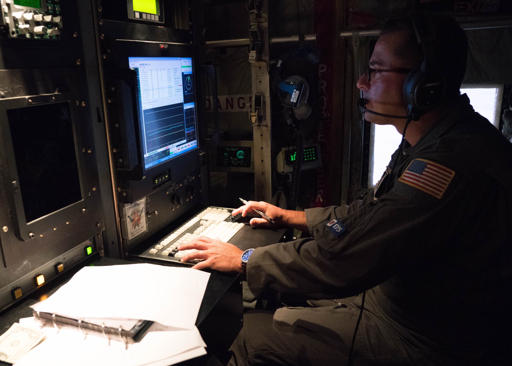 Maj. Douglas Gautrau, aerial reconnaissance weather officer with the 53rd Weather Reconnaissance Squadron, reviews weather data collected during a mission into Hurricane Douglas July 24, 2020. The data is sent to the Central Pacific Hurricane Center to assist with their forecasts. The 53rd WRS, better known as the Air Force Reserve Hurricane Hunters, is assigned to the 403rd Wing at Keesler Air Force Base, Mississippi. Crews departed the base July 22 and started conduct operations out of Barbers Point Kapolie Airport, Hawaii, July 24, 2020. (U.S. Air Force photo by Lt. Col. Marnee A.C. Losurdo)