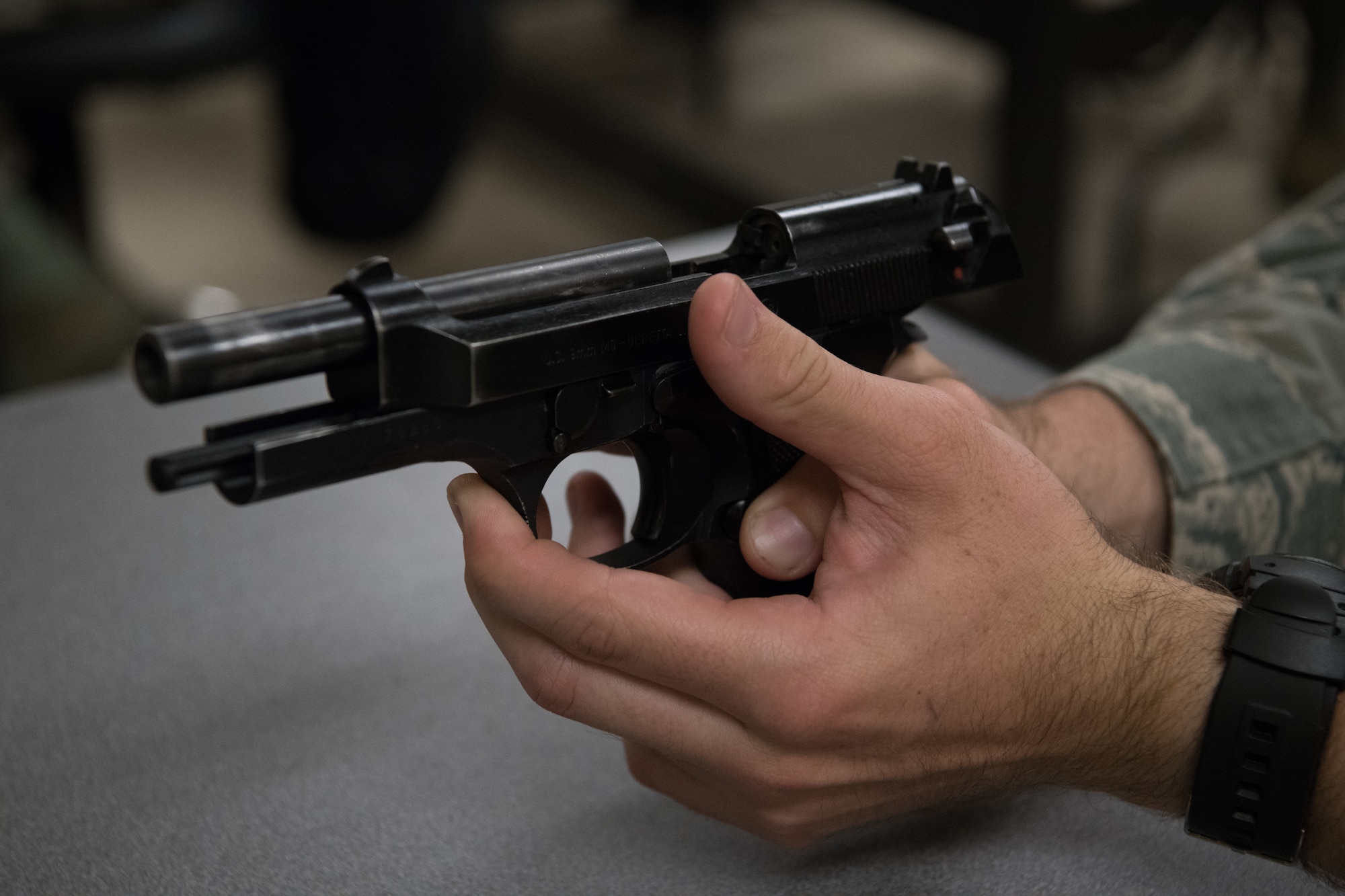 An Air Force Reserve Officer Training Corps cadet handles a Beretta M9 pistol during a class session July 9, 2020, at the Combat Arms Training and Maintenance facility on Maxwell Air Force Base, Alabama.