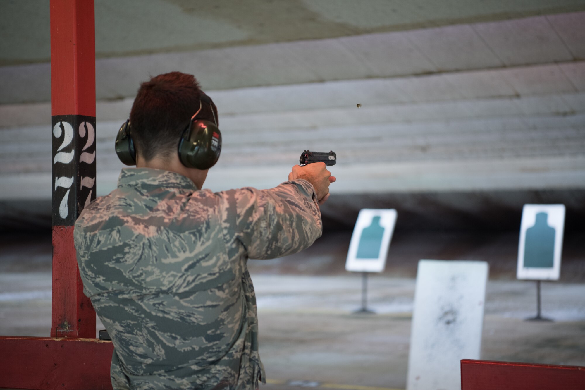 Air Force Reserve Officer Training Corps cadets take their paper targets off the stands.