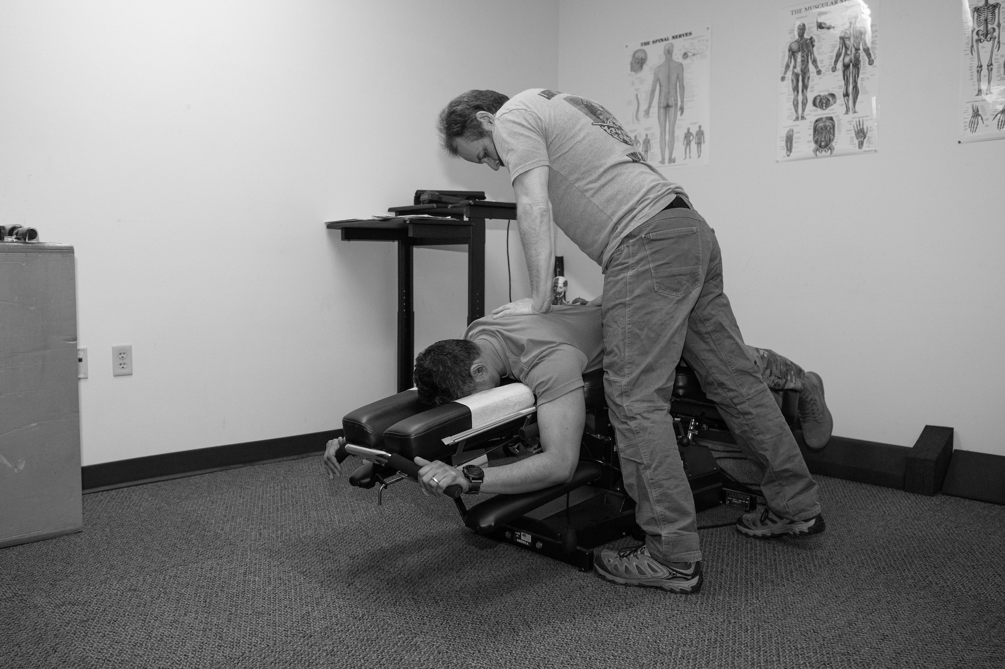 Todd O’Mealy, chiropractor at Madigan Army Medical Center, makes a chiropractic adjustment to a 5th Air Support Operations Squadron Tactical Air Control Party Airman at Joint Base Lewis-McChord, Wash., March 3, 2020.