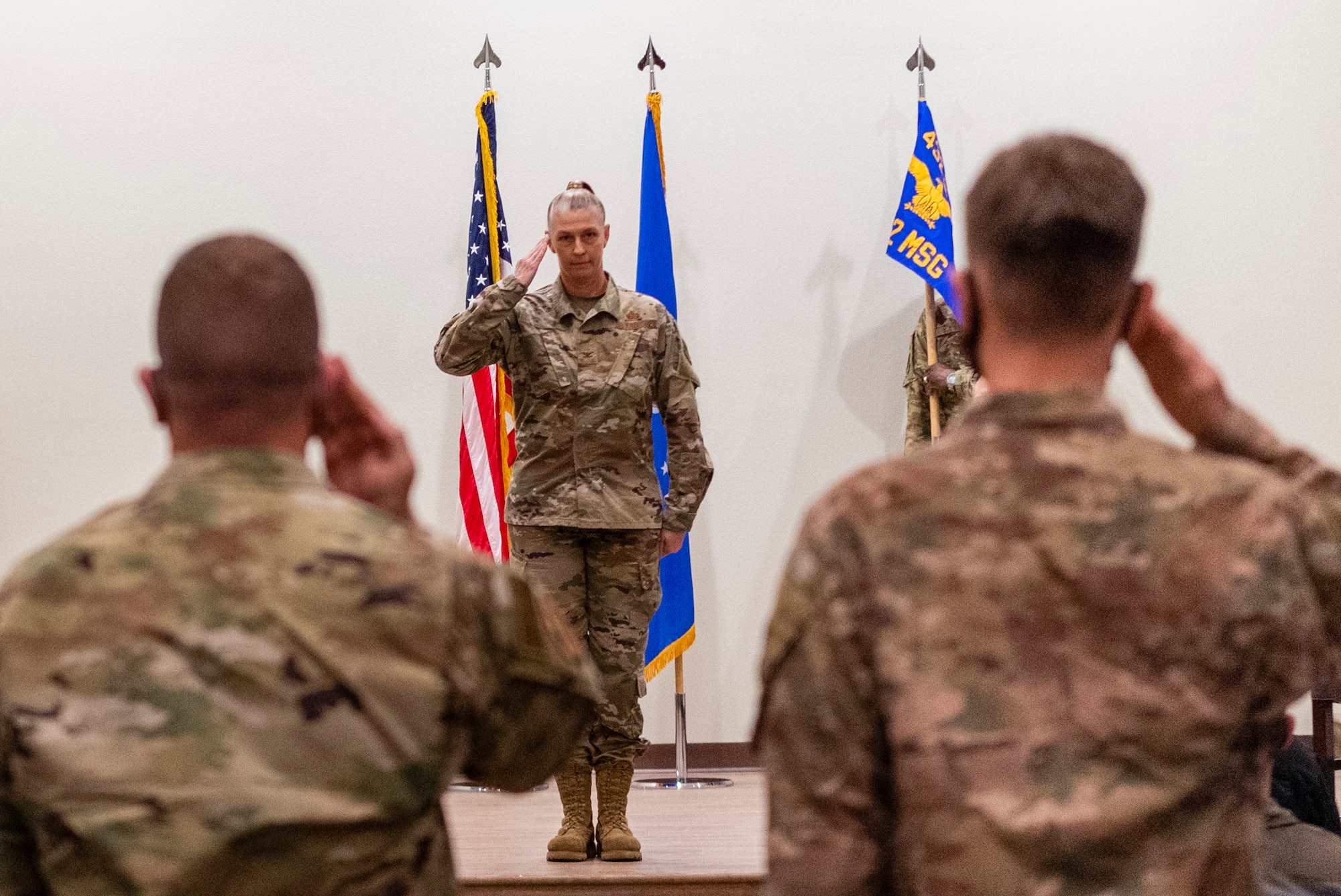 Col. Dina, 432nd Mission Support Group commander, receives the first salute from her squadron commanders during the assumption of command ceremony at Creech Air Force Base.