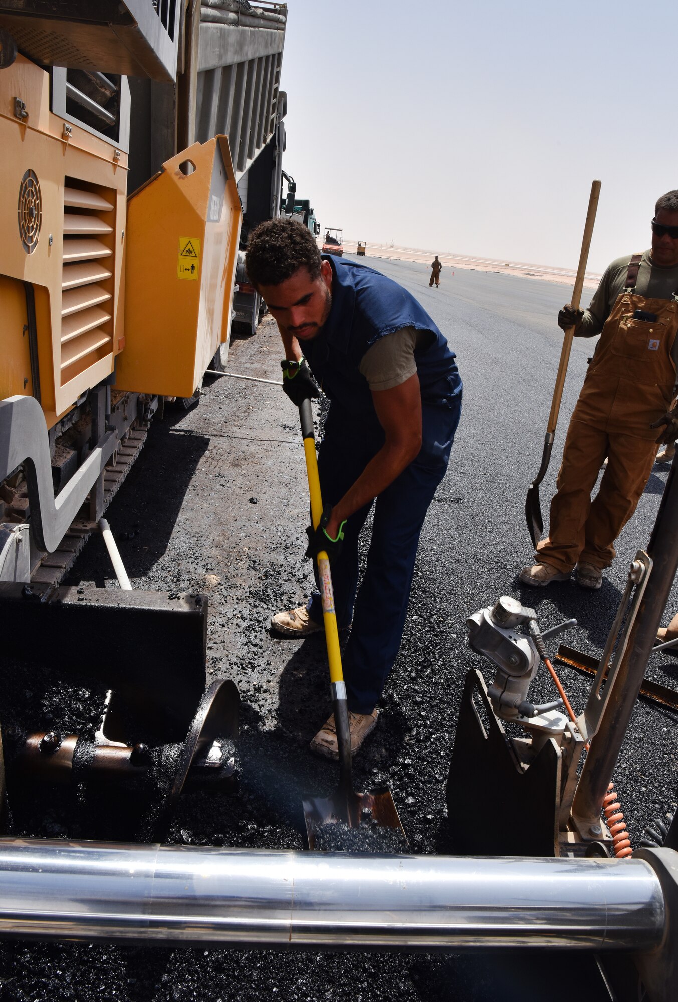 Airmen from the 378th Expeditionary Civil Engineer Squadron Dirt Boys shop work to finish construction on the new helicopter pad at Prince Sultan Air Base, Kingdom of Saudi Arabia.