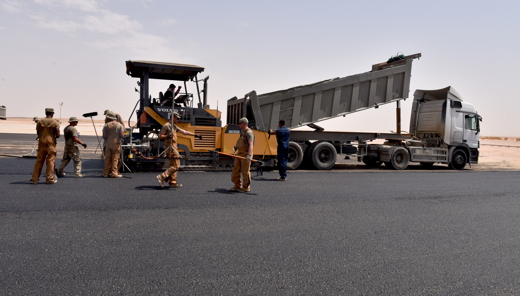 Airmen from the 378th Expeditionary Civil Engineer Squadron Dirt Boys shop work to finish construction on the new helicopter pad at Prince Sultan Air Base, Kingdom of Saudi Arabia.