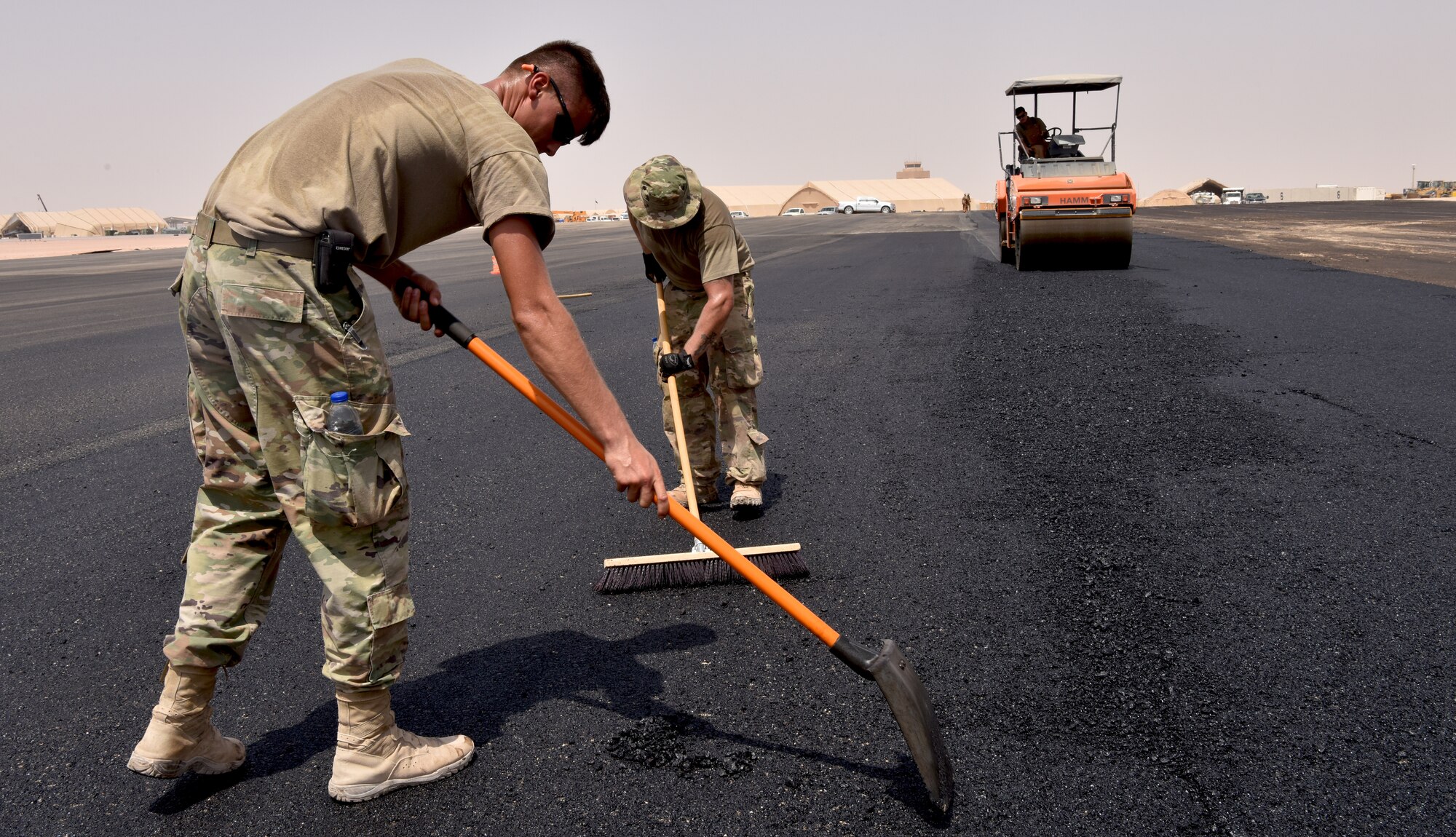 Airmen from the 378th Expeditionary Civil Engineer Squadron Dirt Boys shop work to finish construction on the new helicopter pad at Prince Sultan Air Base, Kingdom of Saudi Arabia.