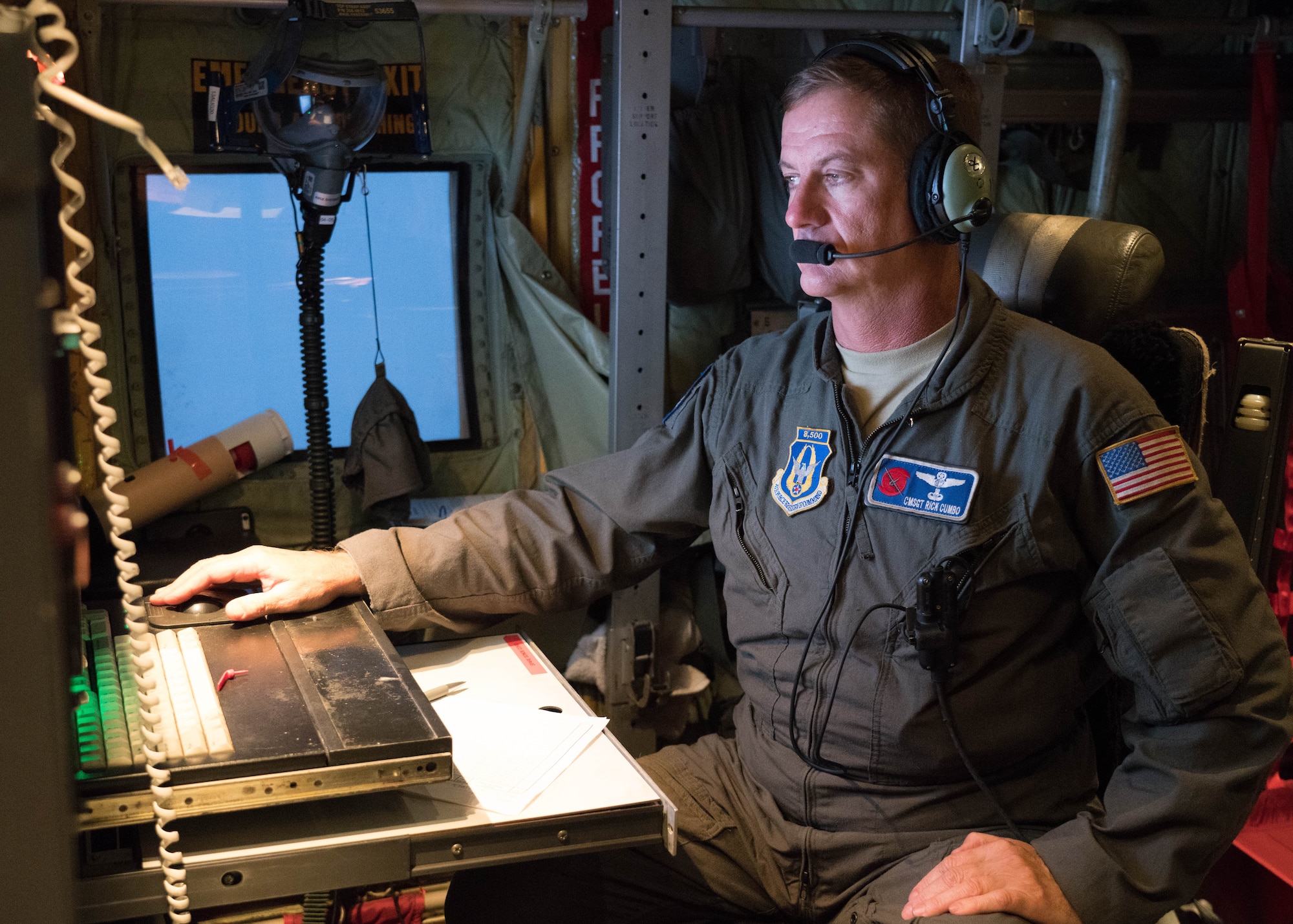 Chief Master Sgt. Rick Cumbo, loadmaster and dropsonde operator, reviews weather data collected during a weather reconnaissance mission into Hurricane Douglas July 24, 2020. Cumbo was part of the Air Force Reserve Hurricane Hunter aircrew who flew into the hurricane to collect data that assists forecasters in improving intensity and movement forecasts. The 53rd Weather Reconnaissance Squadron, assigned to the 403rd Wing at Keesler Air Force Base, Mississippi, departed July 22 to conduct operations out of Barbers Point Kapolie Airport, Hawaii. (U.S. Air Force photo by Lt. Col. Marnee A.C. Losurdo)