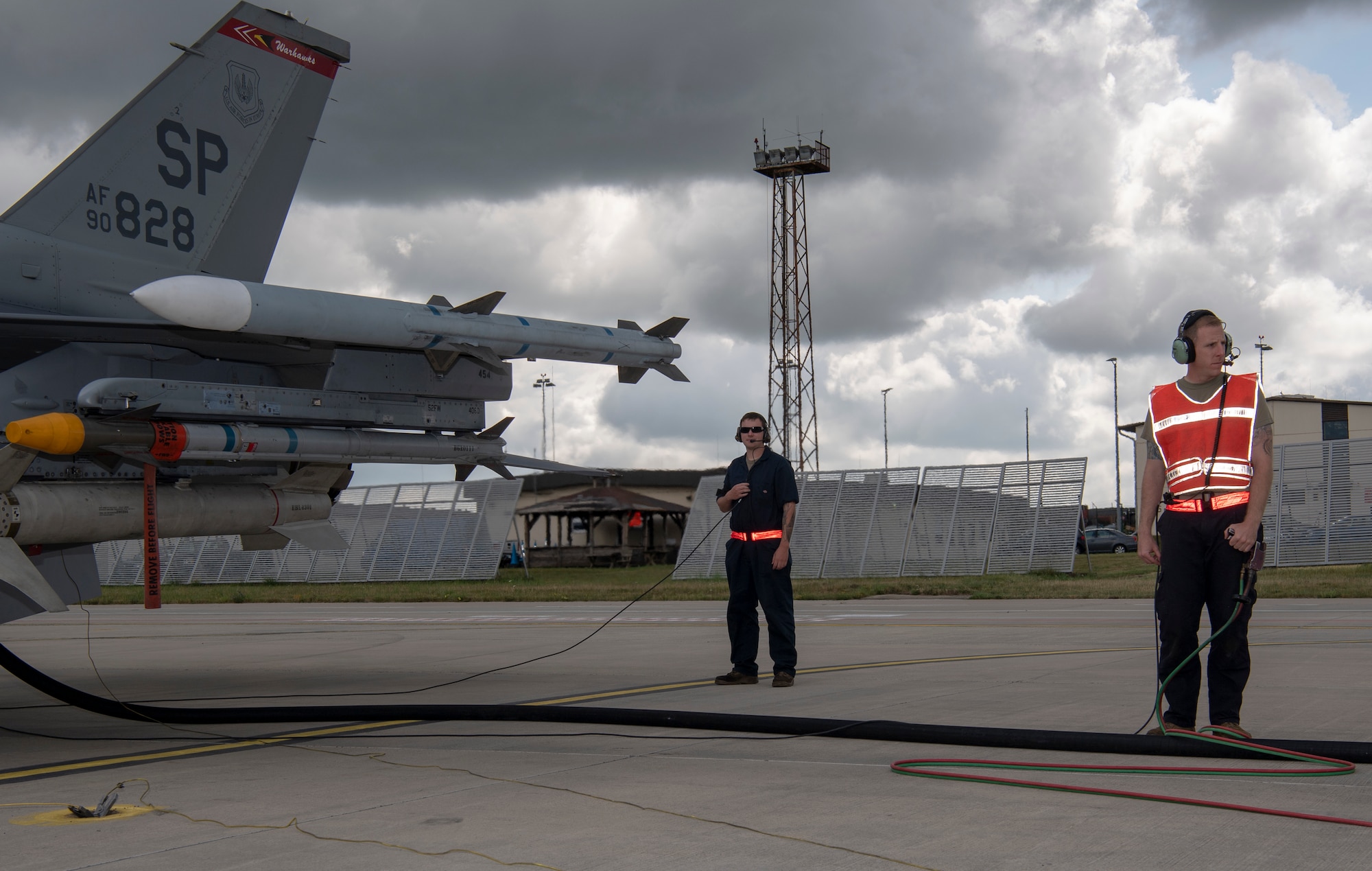 Military aircraft and Airmen on the flight line