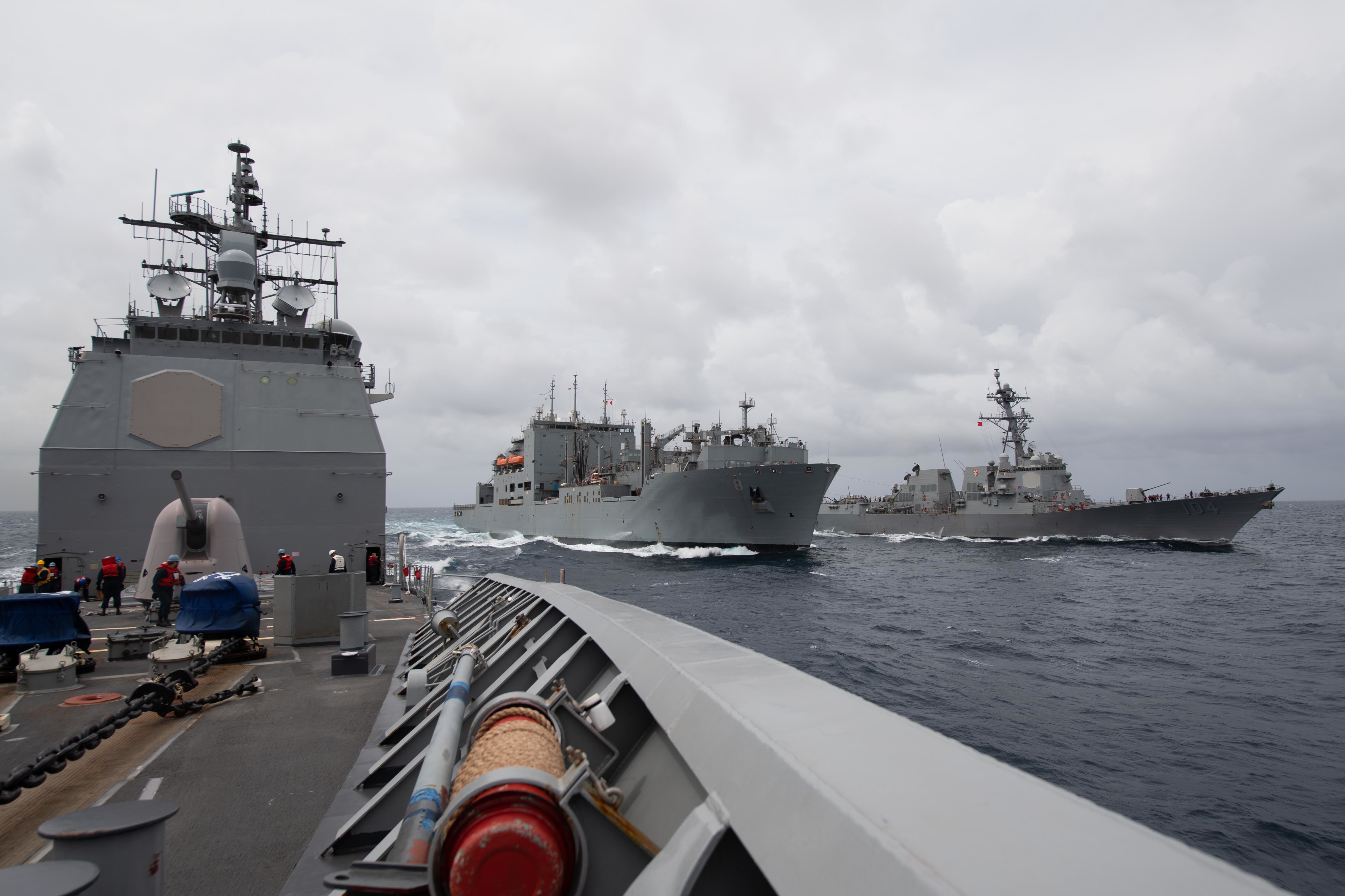 USS Princeton (CG 59) steams away after conducting a replenishment-at-sea.