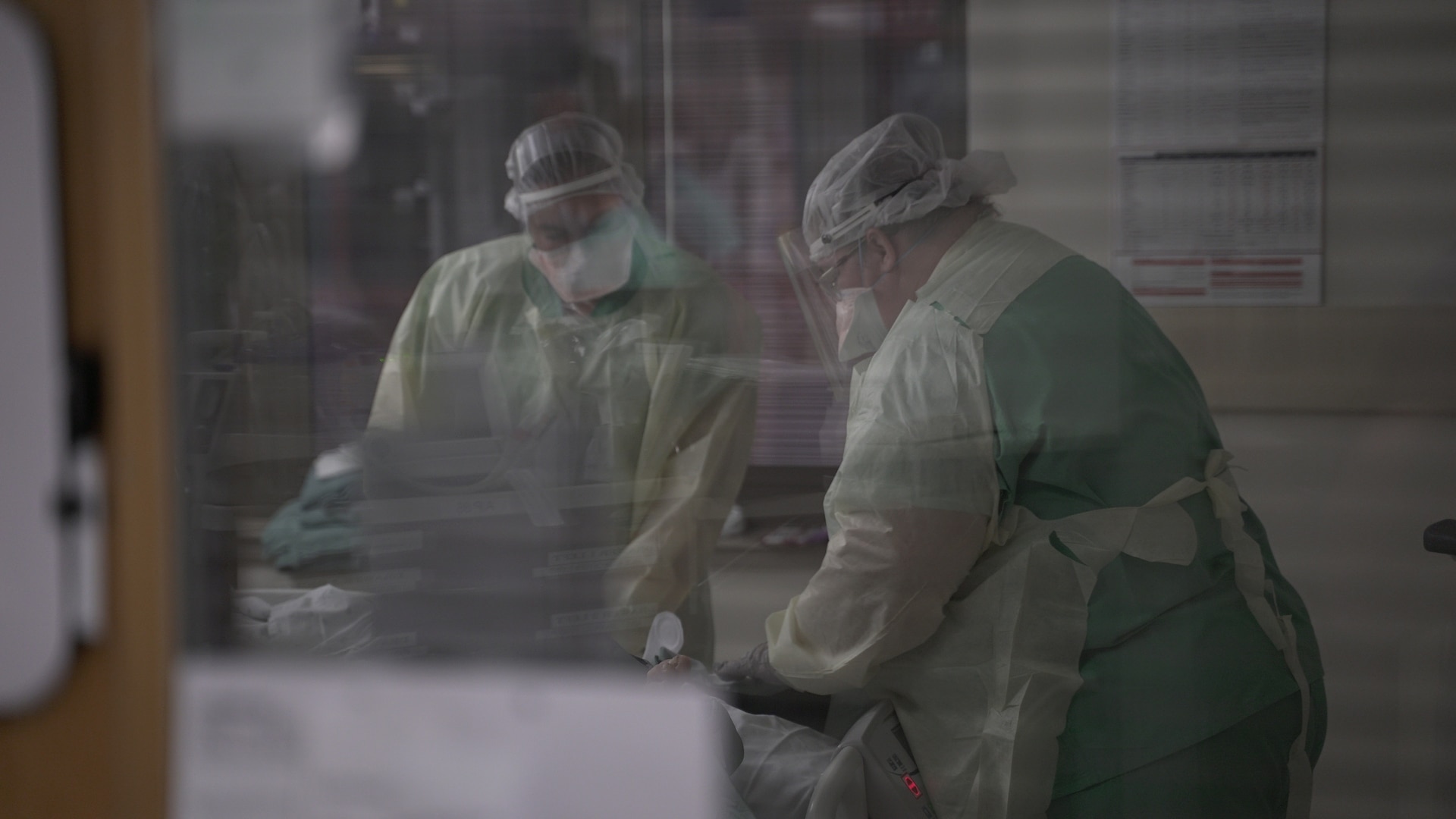 Brooke Army Medical Center nurses tend to a patient in a COVID-19 intensive care unit, July 17, 2020. (U.S. Army photo by James Camillocci)