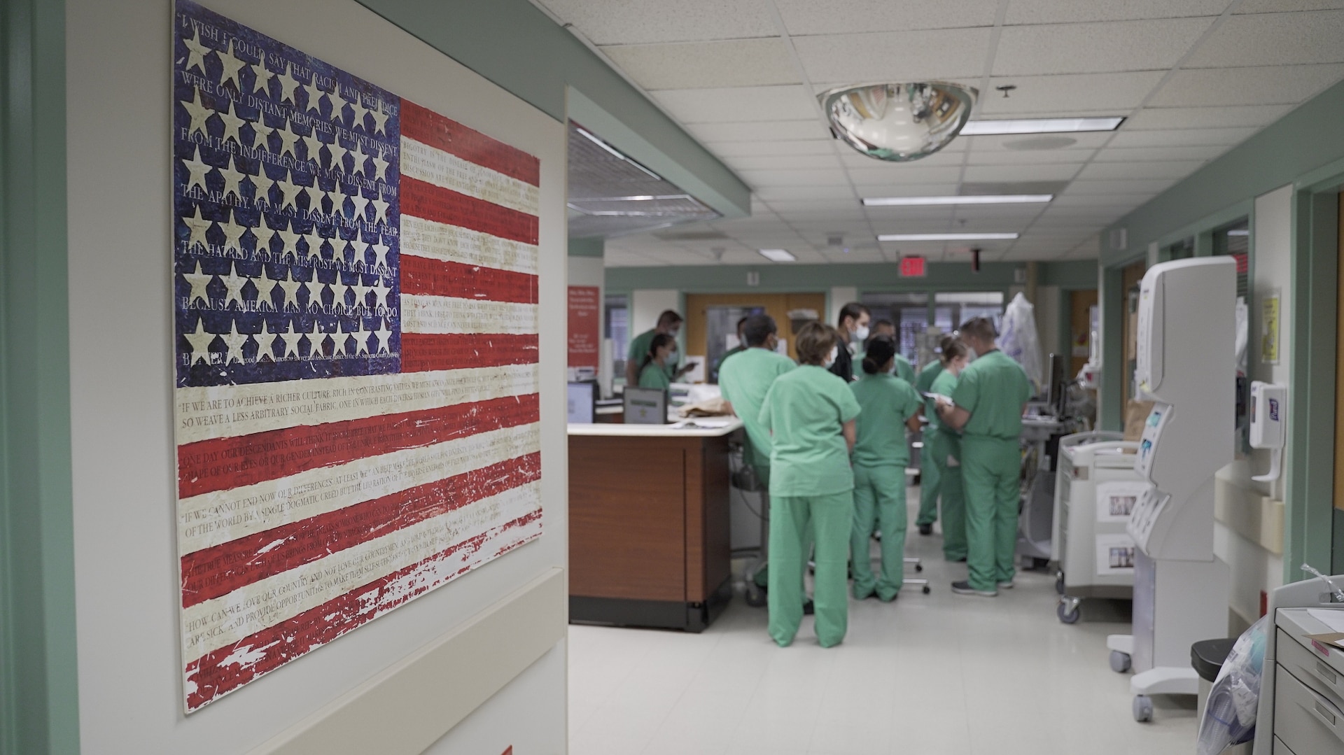 Brooke Army Medical Center nurses conduct a shift change briefing in a COVID-19 intensive care unit, July 17, 2020. (U.S. Army photo by James Camillocci)