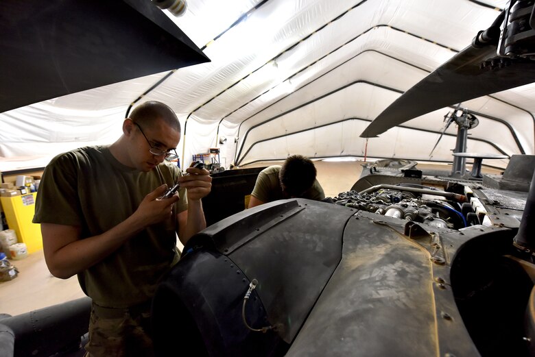 U.S. Army Soldiers from Task Force Javelin conduct maintenance on a UH-60 Blackhawk helicopter at Prince Sultan Air Base, Kingdom of Saudi Arabia