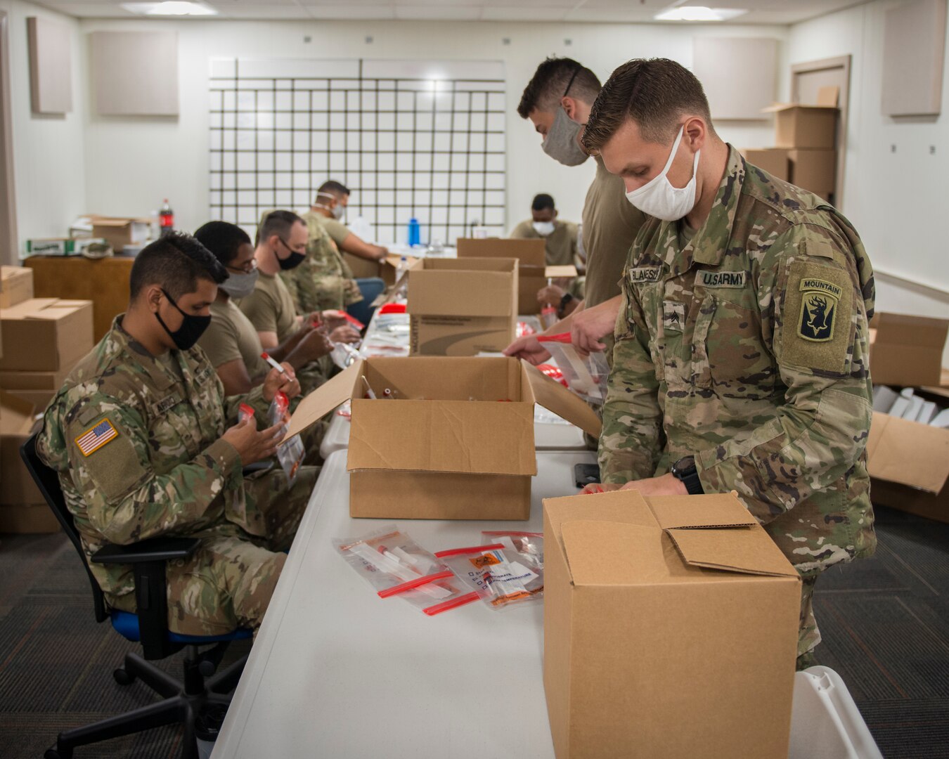 Soldiers from the 1-102nd Infantry Regiment assemble COVID-19 test kits at the Governor William A. O’Neill Hartford State Armory, Hartford, Connecticut, July 27, 2020.