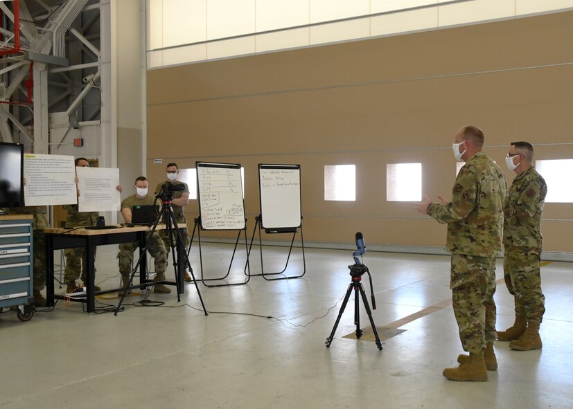Master Sgt. Bob Oleksak, 104th Maintenance Group fabrication Element supervisor, and Master Sgt. Leo Burbee, 104th Maintenance Group structural maintenance supervisor, present their idea for a new cold work aircraft panel repair method via televideo conference June 12, 2020, at Barnes Air National Guard Base, Massachusetts. Oleksak and Burbee presented their idea to the judges as one of the final four teams competing. (U.S. Air National Guard photo by Airman 1st Class Sara Kolinski)