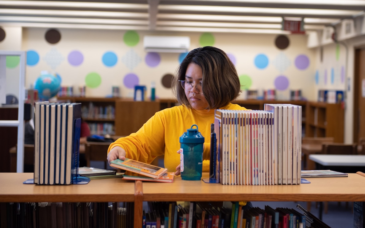 sailor studying in library