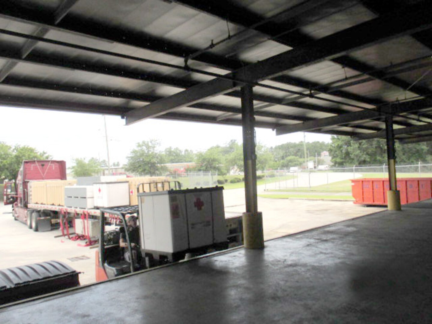 Bradley Chapin, an Air Force Medical Readiness employee at Charleston, operates the forklift to load the five Alaska Medical Shelters for shipment.