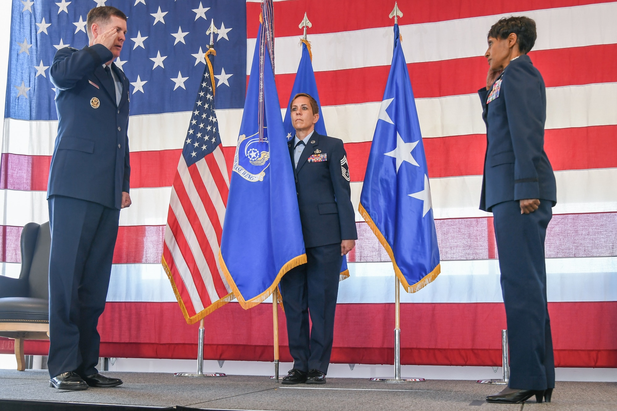 Col. Jenise M. Carroll, right, renders a salute to Lt. Gen. Gene Kirkland, left, Air Force Sustainment Center commander