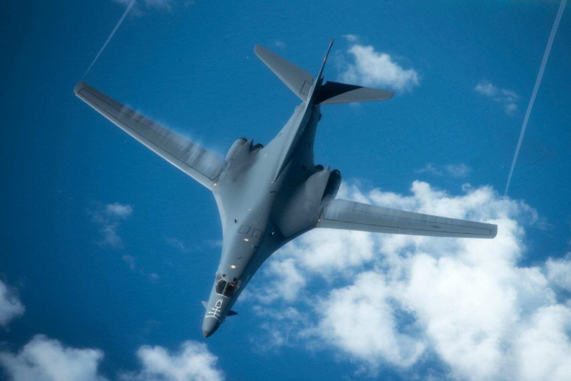 A 28th Bomb Wing B-1B Lancer, from Ellsworth Air Force Base, S.D., conducts aerial refueling with a 909th Aerial Refueling Squadron KC-135 Stratotanker, from Kadena Air Base, Japan, during a Bomber Task Force (BTF) mission July 27, 2020. The BTF missions are intended to demonstrate U.S. commitment to the collective defense of the U.S. Indo-Pacific Command theater and are a visible demonstration of the U.S. capability of extended deterrence. (U.S. Air Force photo by Staff Sgt. Peter Reft)