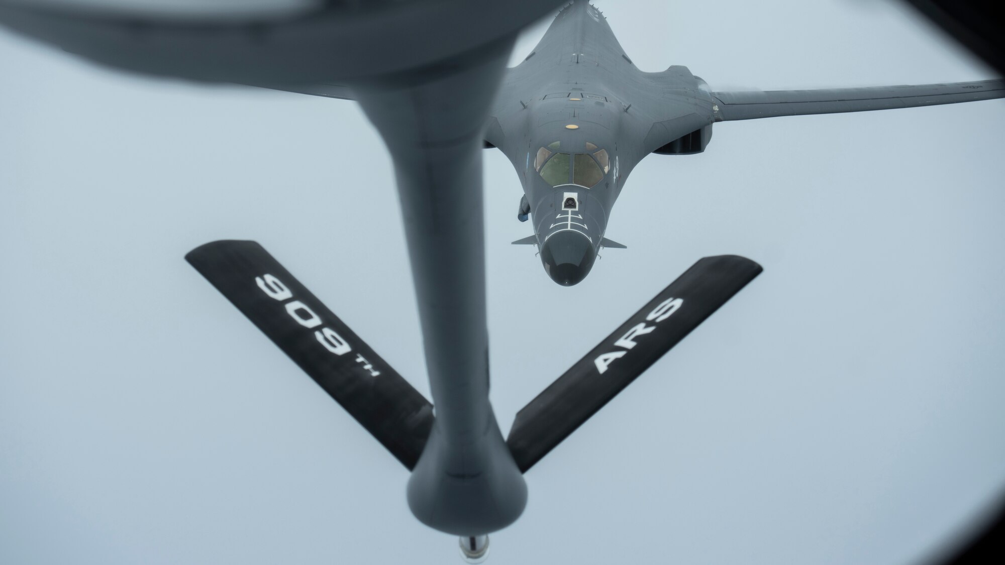 A 28th Bomber Wing B-1B Lancer, from Ellsworth Air Force Base, S.D., conducts aerial refueling with a 909th Aerial Refueling Squadron KC-135 Stratotanker, from Kadena Air Base, Japan, during a Bomber Task Force (BTF) mission, July 27, 2020. The BTF supports the U.S. Air Force’s dynamic force employment model in line with the National Defense Strategy’s objectives of strategic predictability with persistent bomber presence. (U.S. Air Force photo by Staff Sgt. Peter Reft)
