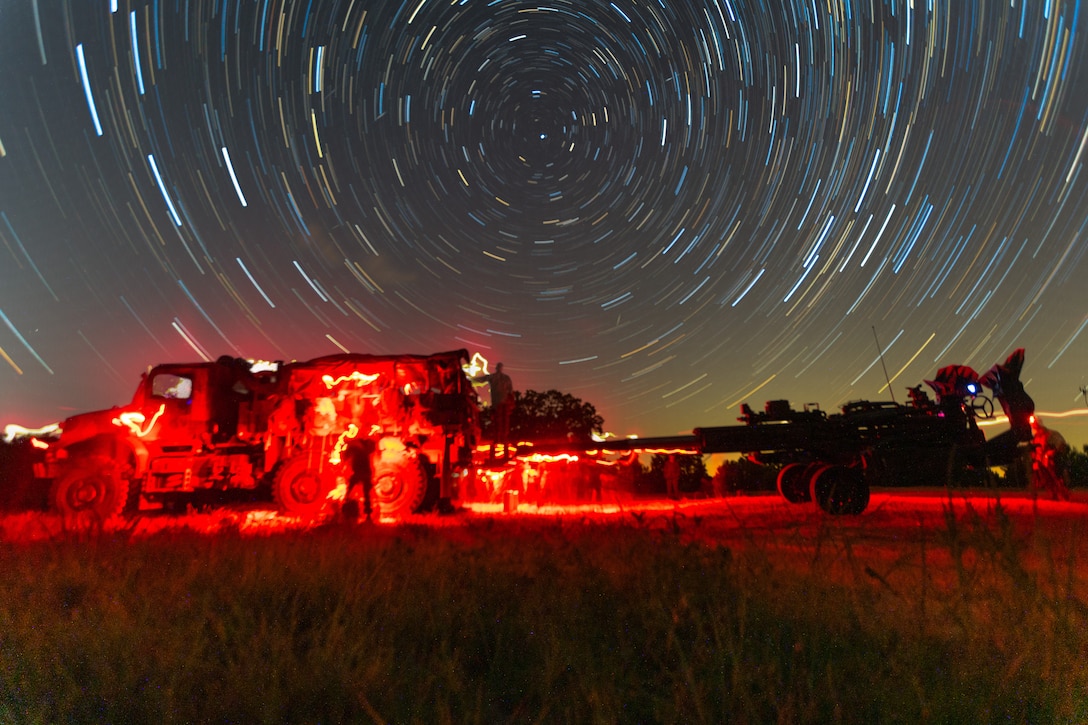 Marine with Hotel Battery, 3rd Battalion, 14th Marine Regiment, 4th Marine Division, prepare to bed down for the night after a live-fire range at Fort Pickett, Va., July 18, 2020, during Hotel Battery’s annual training. The Marine Corps Reserves was established on Aug. 29, 1916, after President Woodrow Wilson signed the Naval Appropriations Act of 1916. Since then, the Marine Corps Reserves have been called upon in every major conflict as well serving in humanitarian and security operations across the globe. This photo was created by stacking 75 images taken over the span of 45 minutes together. (U.S. Marine Corps photo by Sgt. Niles Lee)