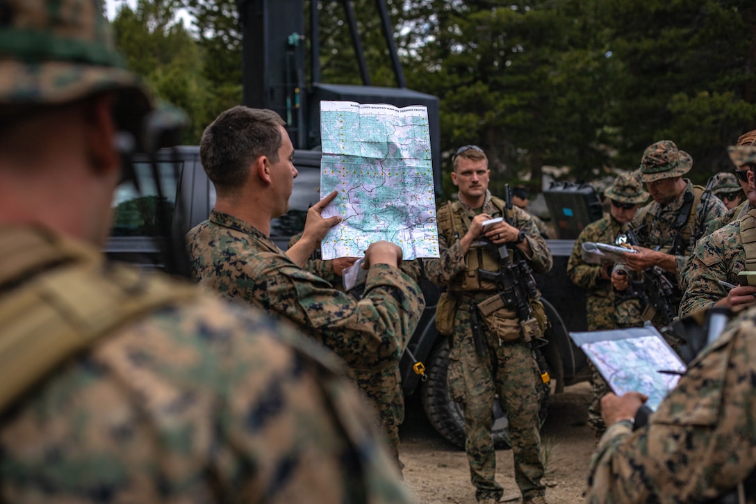 Marines with Echo Company, 4th Reconnaissance Battalion, 4th Marine Division are given a survival class during a guided training course aboard Marine Corps Mountain Warfare Training Center, Bridgeport, Calif., July 24, 2020. MCMWTC offers a unique training experience for the Marines with 4th Recon to prepare and develop an understanding of traversing a mountainous environment as they maintain their readiness to fight in any clime and place. (U.S. Marine Corps photo by Lance Cpl. Ryan Schmid)