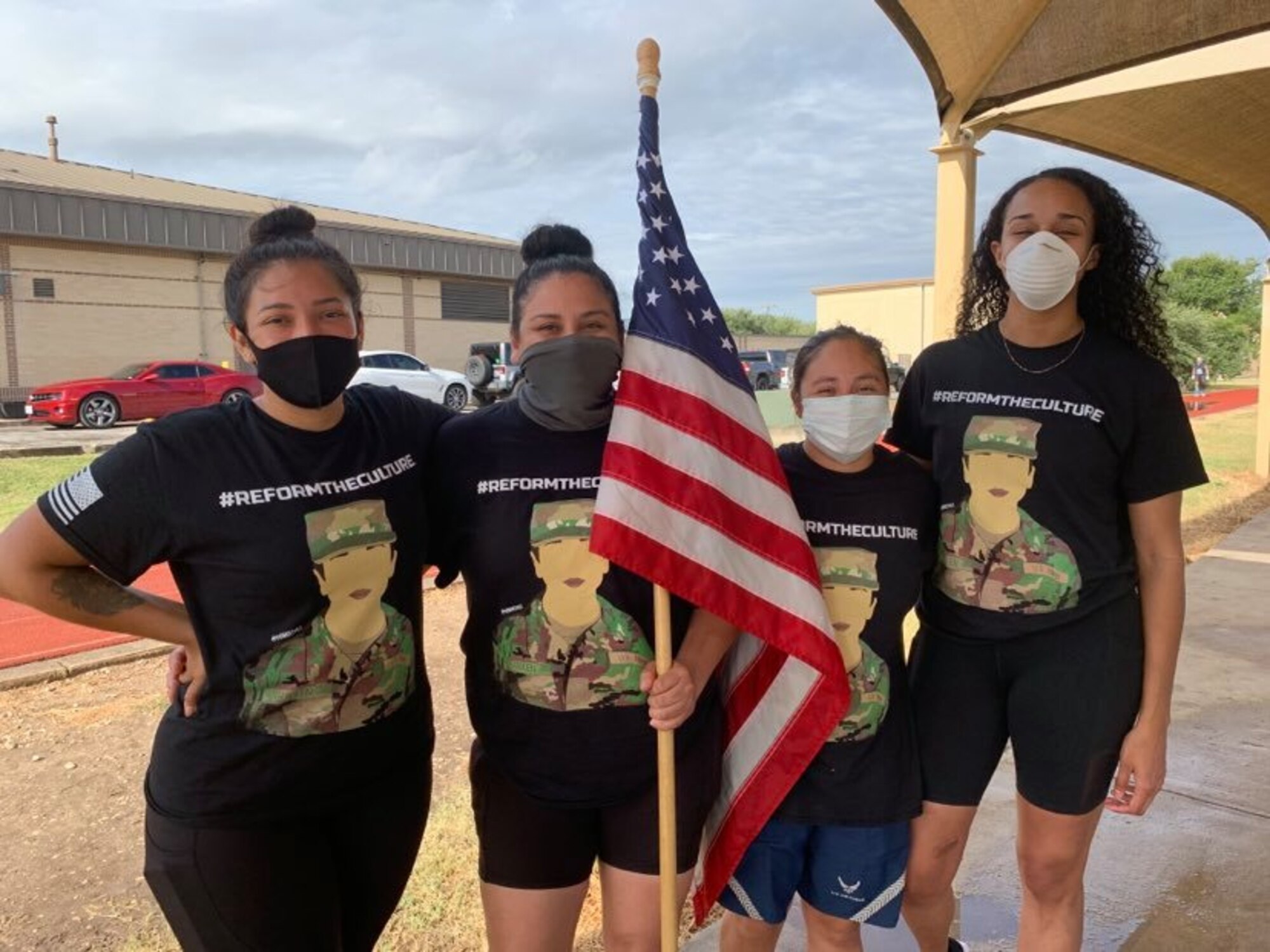 The four event coordinators, Technical Sgt. Alejandra Avila, Staff Sgt. Solenine Izquierdo, Staff Sgt. Melissa Garcia and Staff Sgt. Monique McDonald, pose for a photo during the 37th Training Wing hosted 24-hour walk honoring fallen U.S. Army SPC Vanessa Guillen, 25-26 July, 2020. The event was a way for community participants to make a stand against injustice and reiterate the DoD's zero tolerance of sexual misconduct and interpersonal violence.