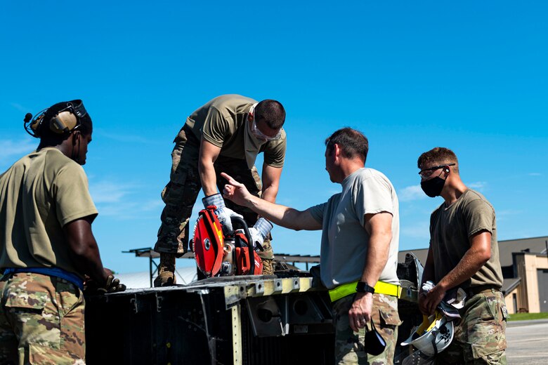 Photo of Airmen conducting crash recovery training.