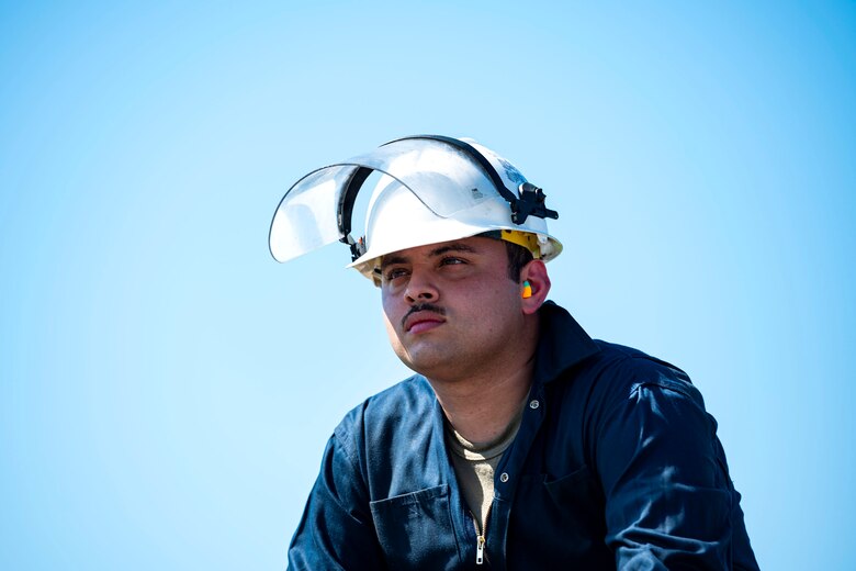 Photo of an Airman waiting for his training supervisor.