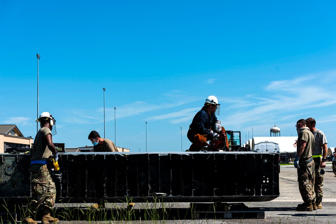 Photo of Airmen conducting crash recovery training.