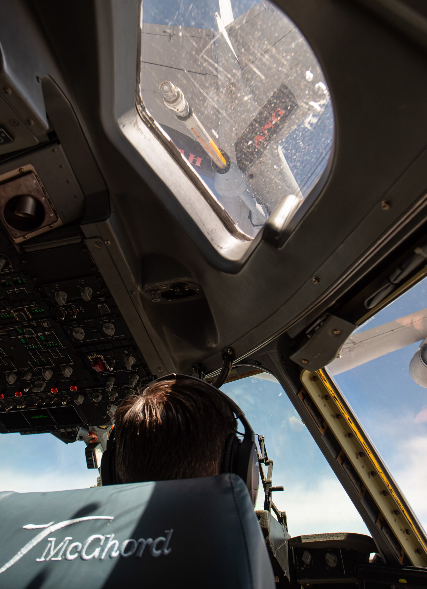 Capt. Shelby Foster, 7th Airlift Squadron (AS) pilot, flies a C-17 Globemaster III assigned to Joint Base Lewis-McChord, Wash., during an air refueling training sortie near Salt Lake City, Utah, July 27, 2020. The 7th AS is testing a new training program to see if it is a viable option for C-17 bases Air Mobility Command-wide. (U.S. Air Force photo by Senior Airman Tryphena Mayhugh)