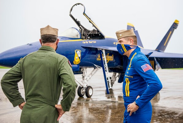 Capt. Eric Doyle, left, director of the Blue Angels Super Hornet Transition Team, delivers the first Blue Angels F/A-18 Super Hornet.