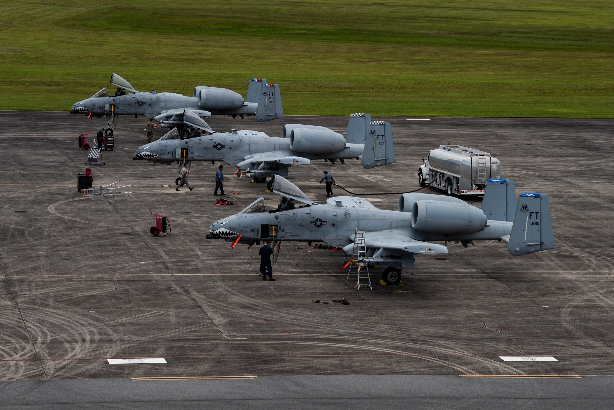 A photo of Airmen performing pre-flight checks