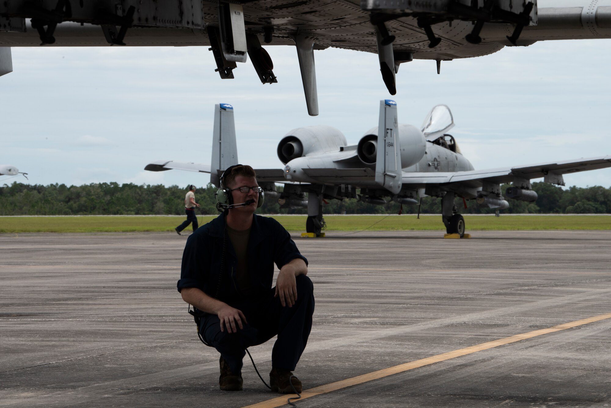 A photo of an Airmen performing pre-flight checks