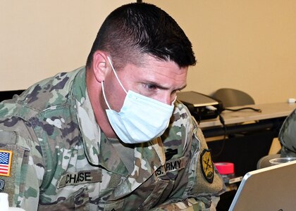 Staff Sgt. Travis Chase, 136th Cyber Security Company, New Hampshire Army National Guard, combats a notional cyberattack made by a foreign government during Cyber Yankee regional training exercise, July 27, 2020, at the Edward Cross Training Center in Pembroke, N.H.