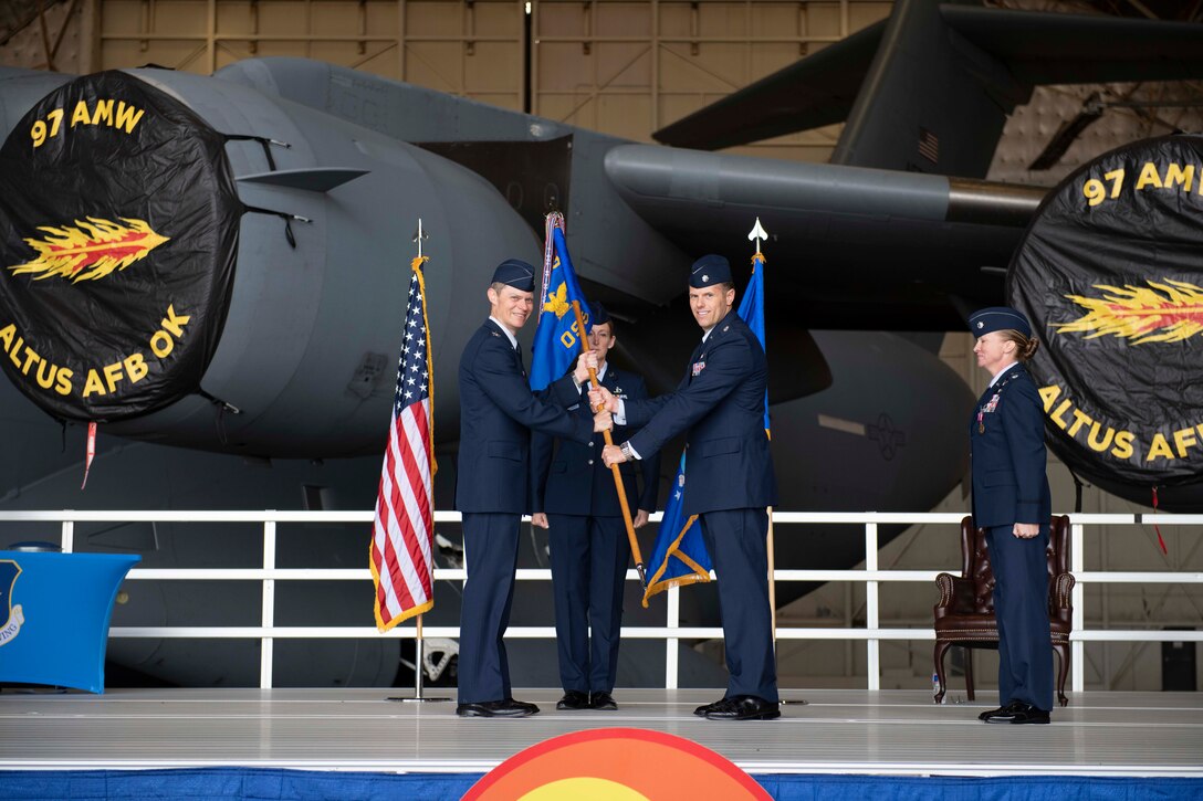 two people holding a flag