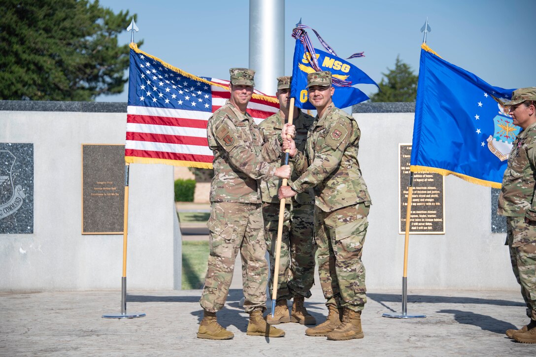 two people holding a flag