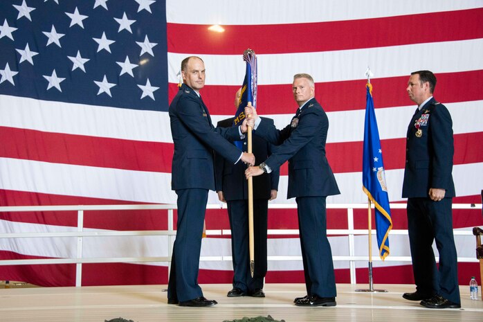 two people holding a flag