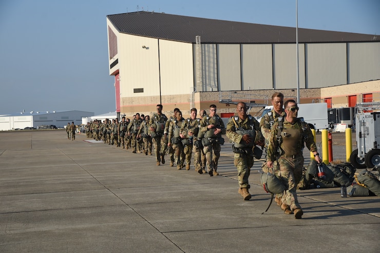 Soldiers of the 4th Brigade Combat Team (Airborne), 25th Infantry Division stationed at Joint Base Elmendorf-Richardson, Alaska walk the flightline to board their assigned C-130J during a Joint Airborne Air Transportability training exercise called Arctic Anvil, Oct. 1-6.