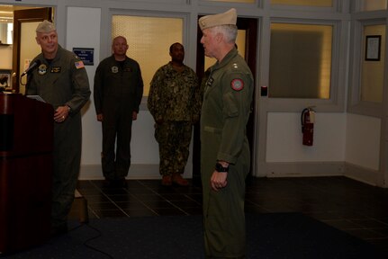 Rear Adm. Dan Cheever (left) relives Rear Adm. Kenneth Whitesell as the commander of Carrier Strike Group (CSG) 4 during the change of command ceremony held at the command’s headquarters building on board Naval Station Norfolk.