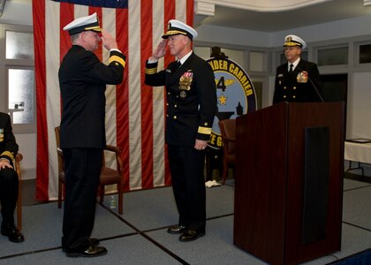 ear Adm. Bruce H. Lindsey, right, relieved Rear Adm. Richard W. Butler as commander of Carrier Strike Group 4 during a change of command and retirement ceremony, Dec. 11.