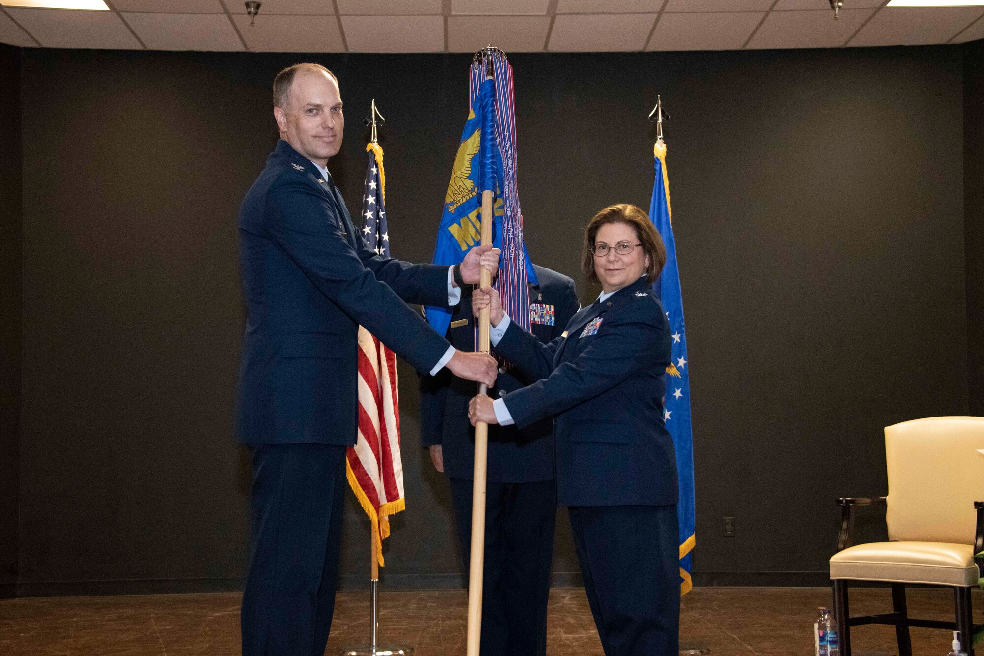 two people holding a flag