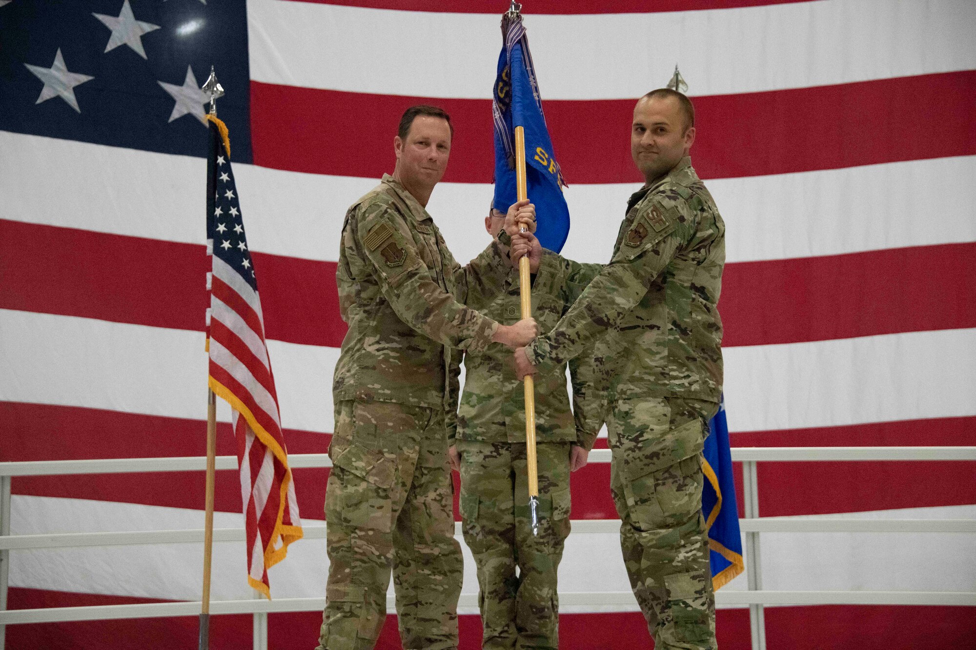 two people holding a flag