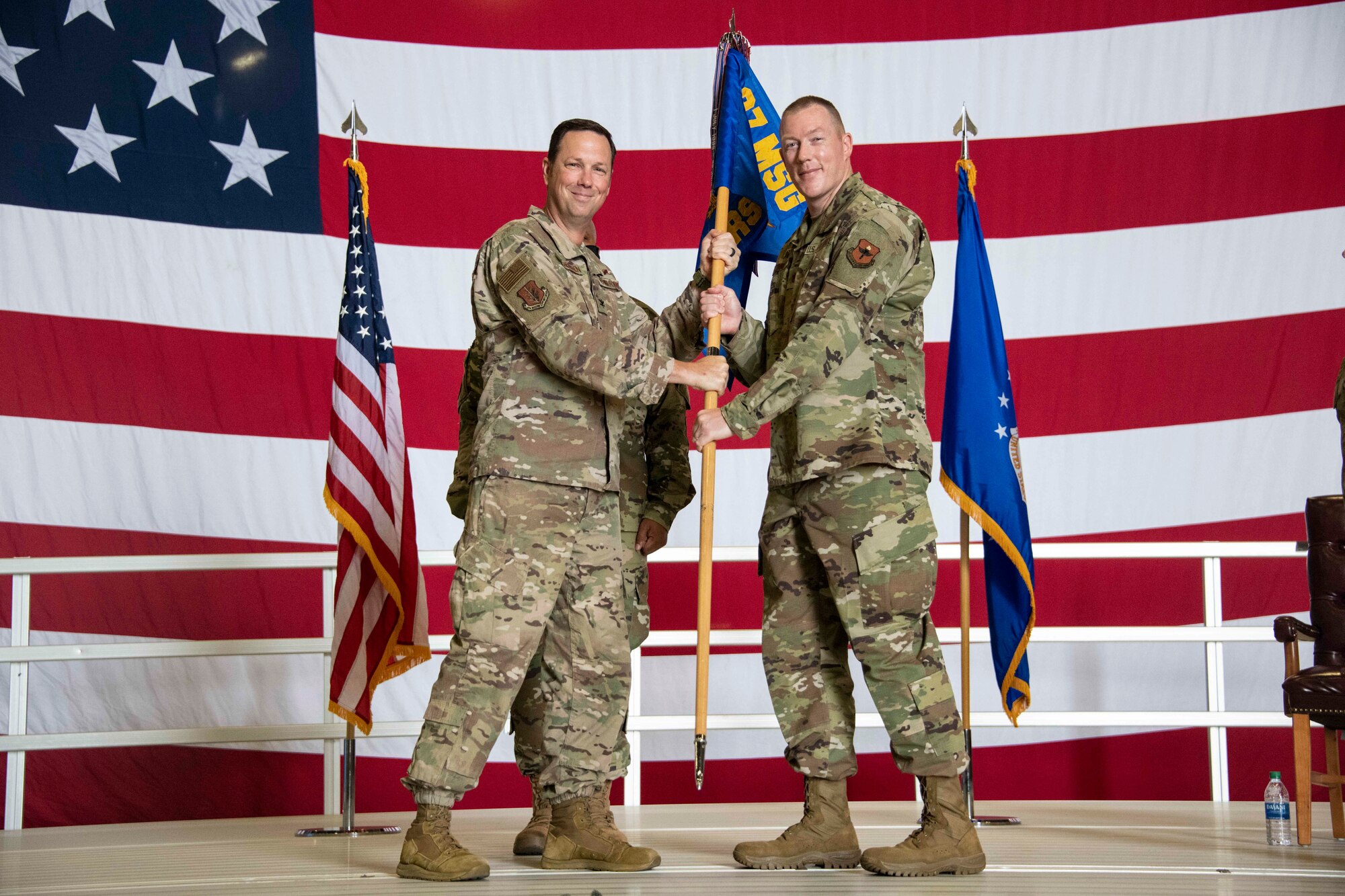 two people holding a flag