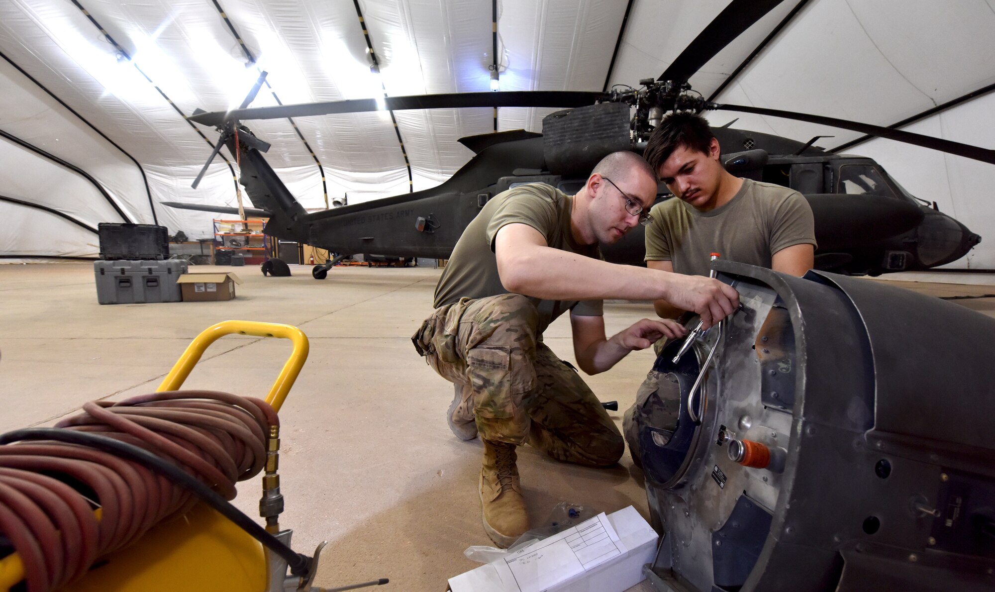 U.S. Army Soldiers from Task Force Javelin conduct maintenance on a UH-60 Blackhawk helicopter at Prince Sultan Air Base, Kingdom of Saudi Arabia